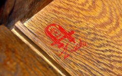 Gustav Stickley red decal signature inside left side, circa 1905-1912.